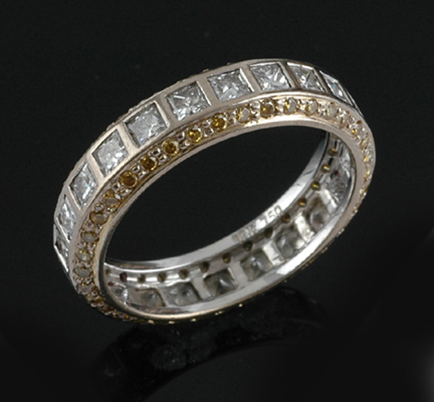 Appraisal: A full circle diamond eternity ring Having a central row