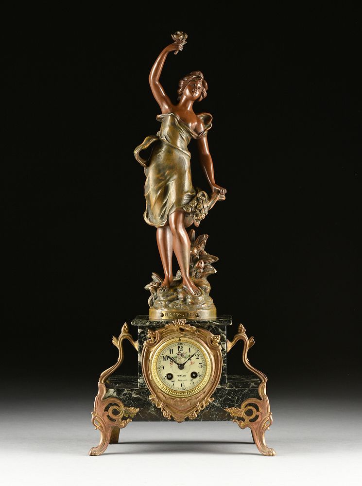 Appraisal: AN ART NOUVEAU PATINATED AND PAINTED SPELTER BLACK MARBLE CLOCK