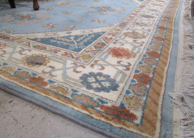 Appraisal: HAND KNOTTED ORIENTAL CARPET Indo-Persian central medallion and stylized floral