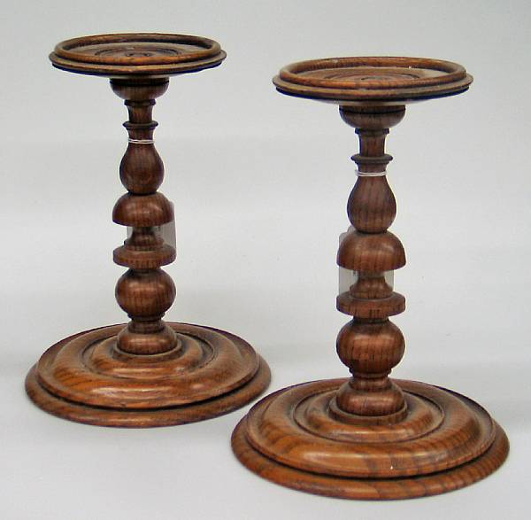 Appraisal: A pair of oak table pedestals The turned standard with