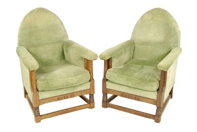 Appraisal: A pair of oak frame easy armchairs with lancet backs