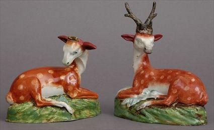 Appraisal: PAIR OF STAFFORDSHIRE DEER MODELS Modeled as a recumbent stag