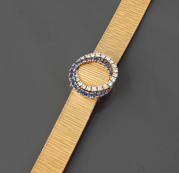 Appraisal: A diamond sapphire and k gold covered dial bracelet wristwatch