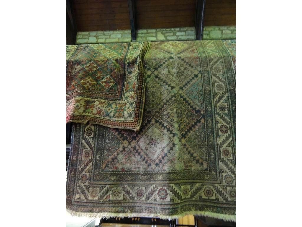 Appraisal: A geometric patterned Middle Eastern rug together with a further