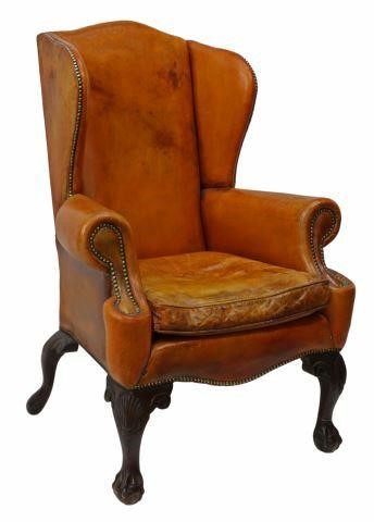 Appraisal: Chippendale style wingback armchair th c in brown leather upholstery