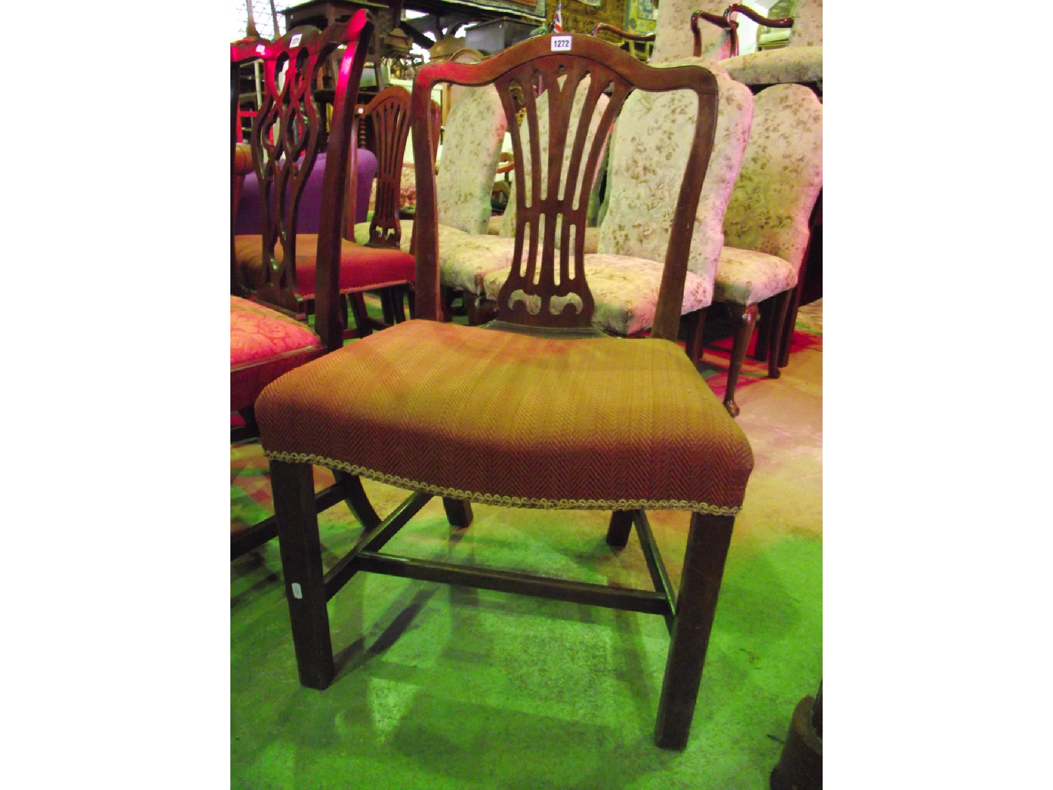 Appraisal: A pair of Georgian mahogany dining chairs in the Hepplewhite