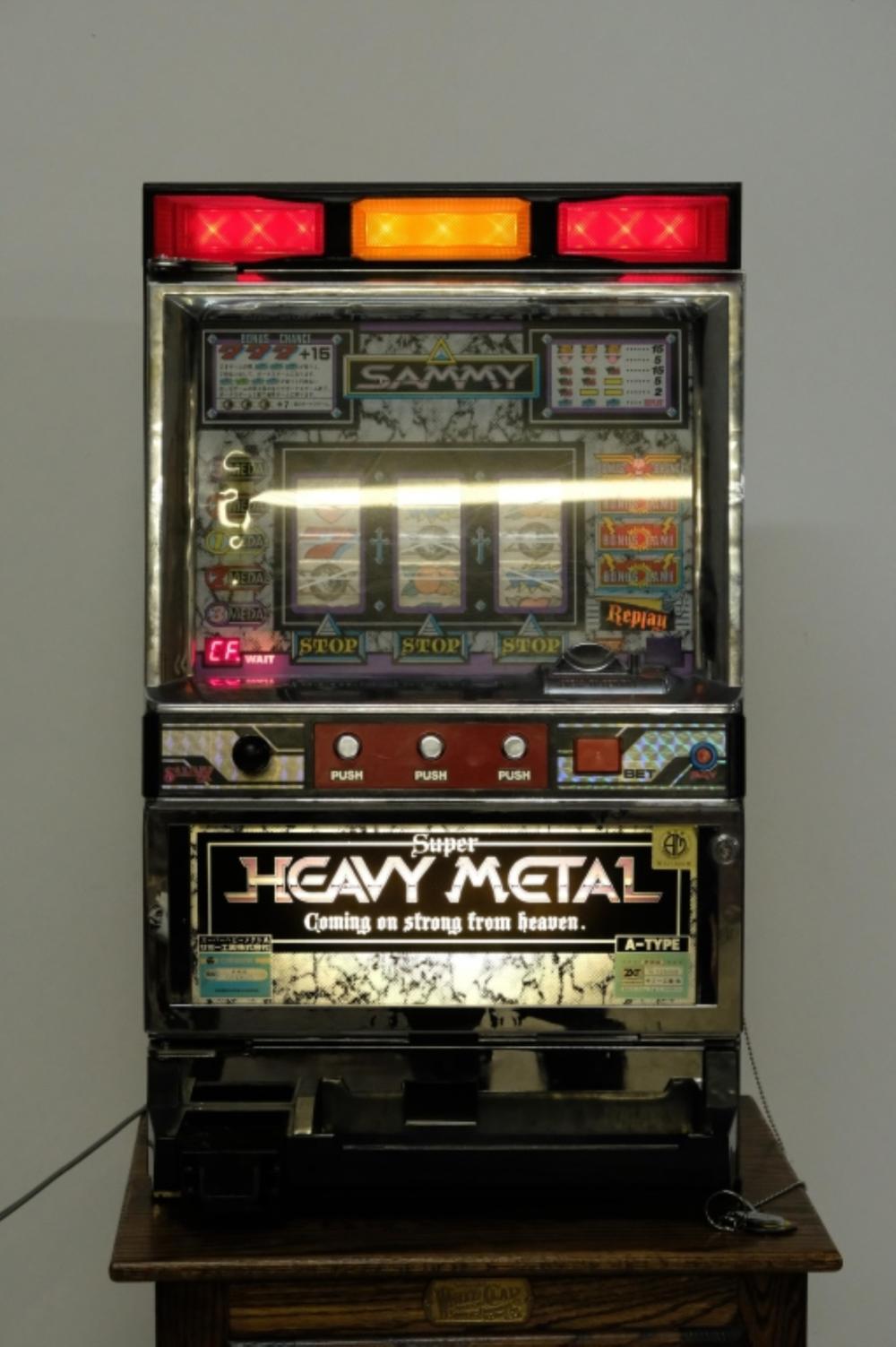 Appraisal: HEAVY METAL SLOT MACHINE ON STANDSammy Heavy Metal slot machine