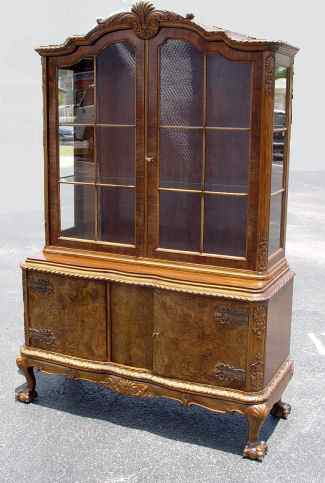 Appraisal: RICHLY GRAINED BURLED WALNUT CHINA CABINET Glass front shelf interior