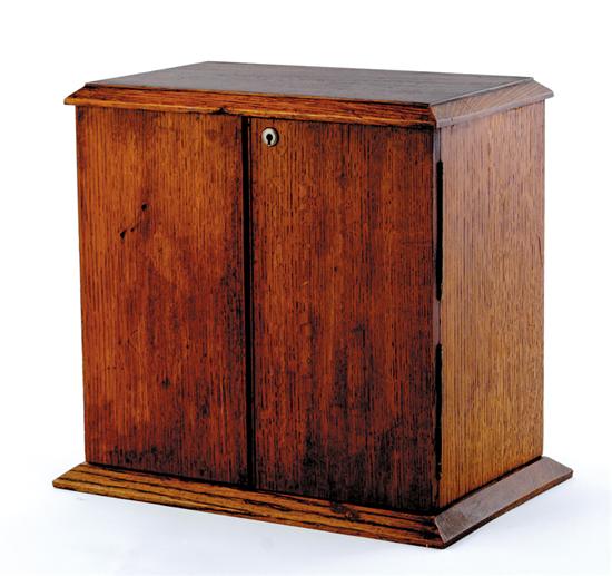 Appraisal: English oak fitted smoking box circa molded edge top over