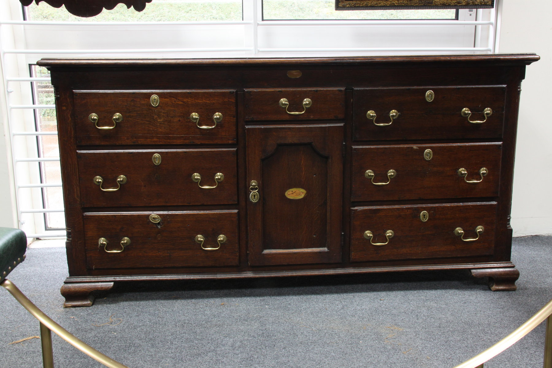 Appraisal: A th Century oak dresser fitted a central cupboard with