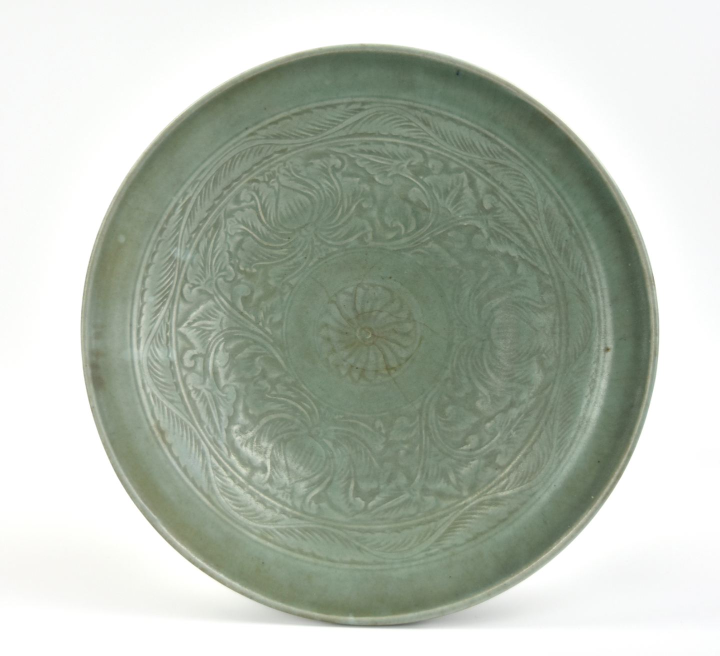 Appraisal: with crackled celadon glaze the center incised with lotus flower