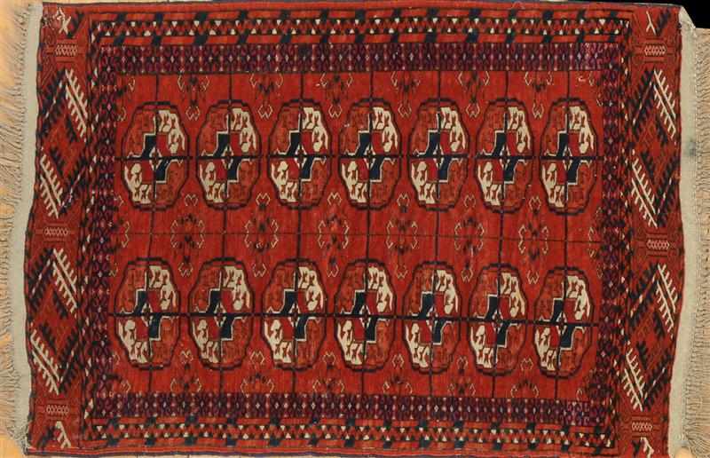 Appraisal: TEKKE RUG Worked with two rows of octagonal guls x