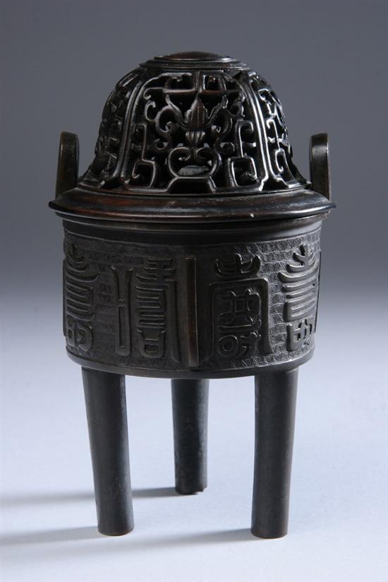 Appraisal: CHINESE BRONZE TRIPOD CENSER Qing Dynasty Calligraphy decoration upright loop-form