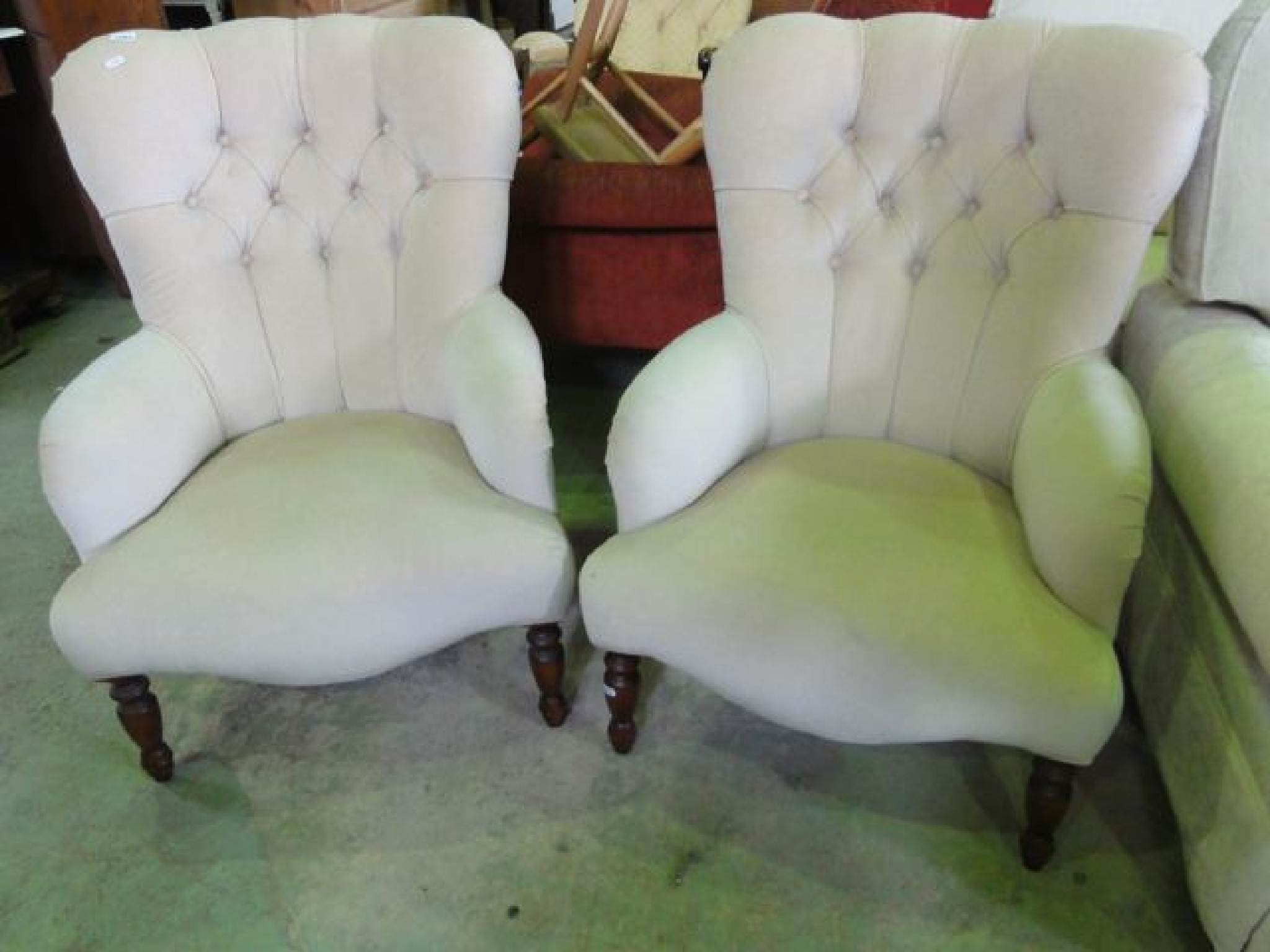 Appraisal: A pair of Victorian style low button back chairs with