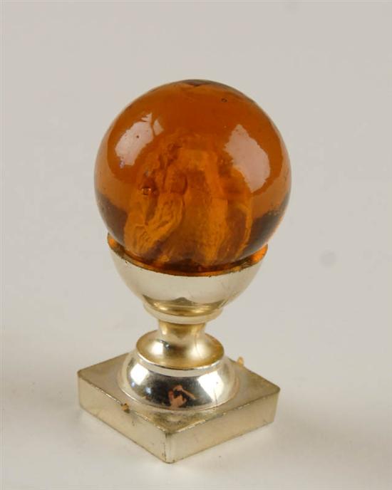 Appraisal: A Large Amber Sulphide Marble having an eagle figure to