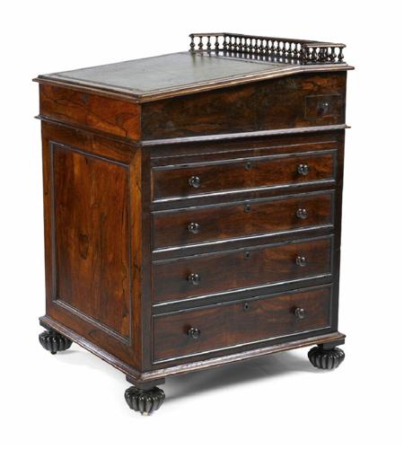 Appraisal: A William IV rosewood Davenport the three quarter galleried top