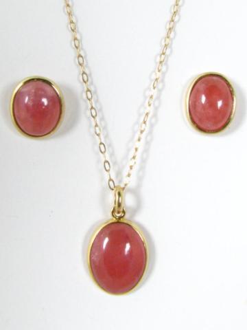 Appraisal: k yellow gold oval shaped cabachon pink tourmaline pendant and