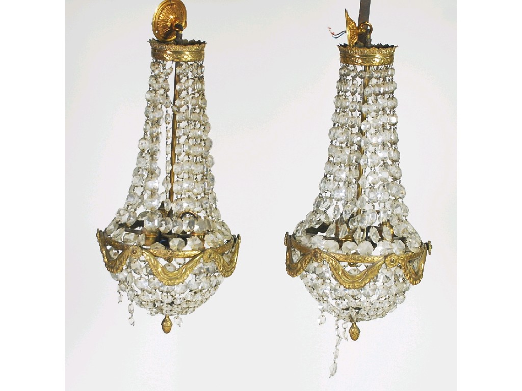 Appraisal: PAIR OF EARLY TWENTIETH CENTURY GILT METAL AND CUT GLASS