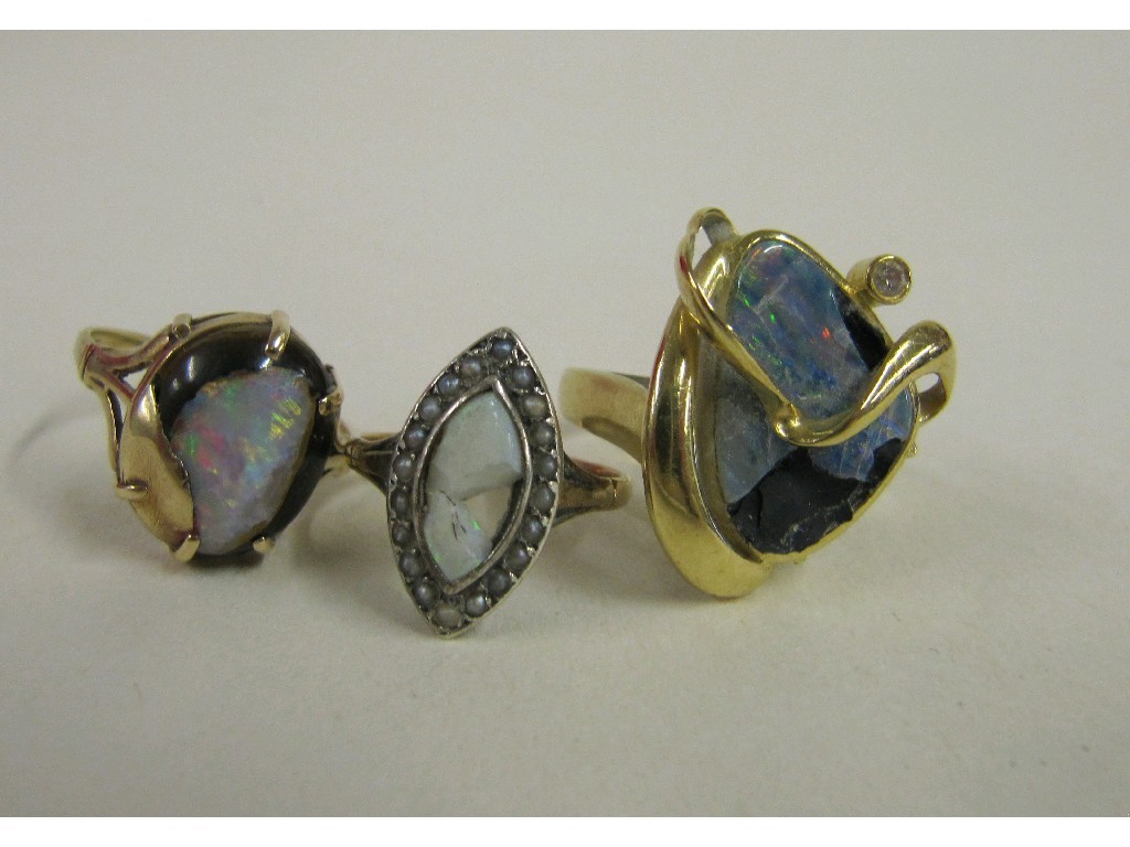 Appraisal: Three gold opal set dress rings