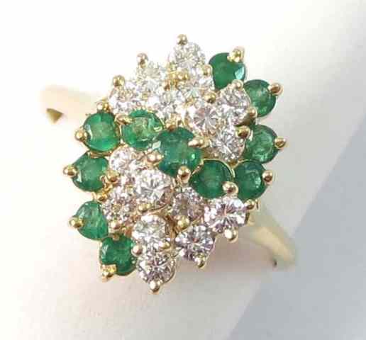 Appraisal: EMERALD DIAMOND AND EIGHTEEN KARAT GOLD RING set with a