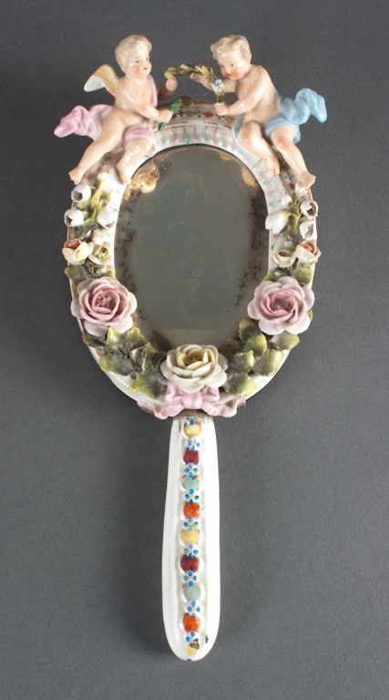 Appraisal: Sitzendorf porcelain hand mirror late th century with applied floral