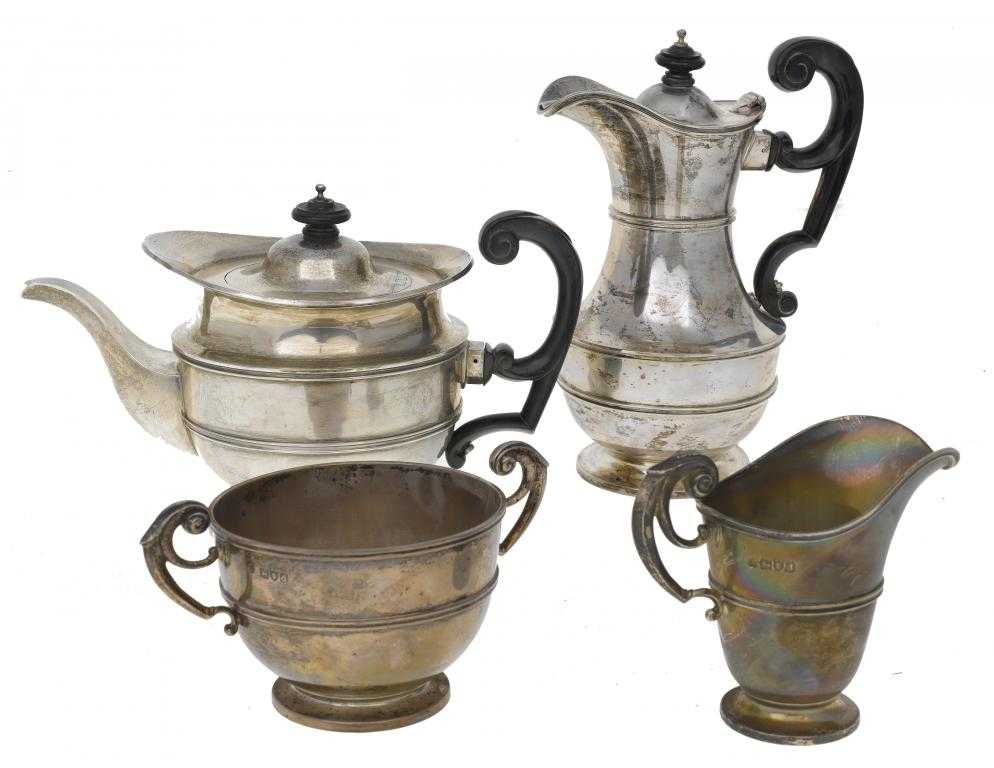 Appraisal: A VICTORIAN FOUR-PIECE TEA SERVICE with leaf capped flying scroll