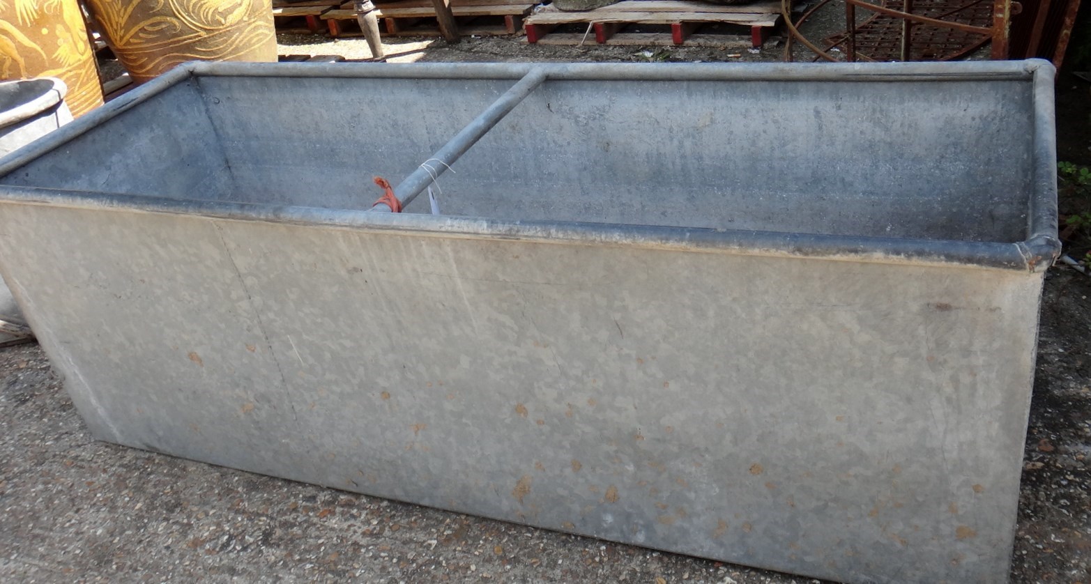 Appraisal: A large rectangular galvanised steel drinking trough cm wide