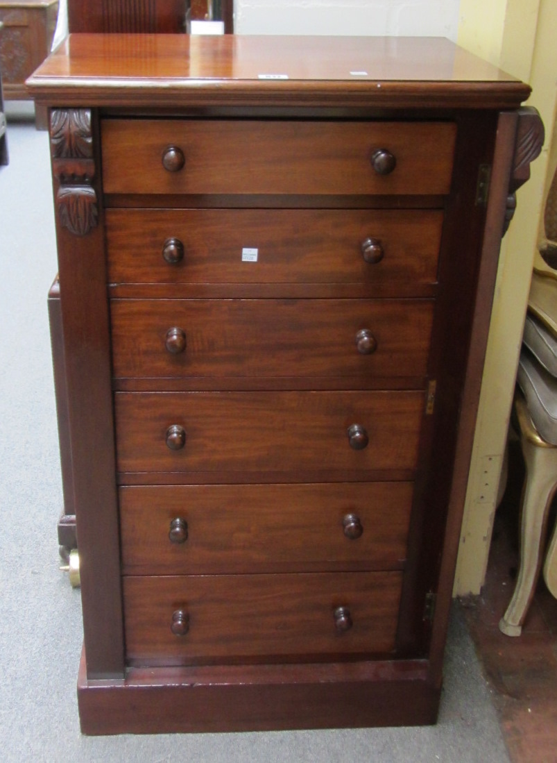 Appraisal: A Victorian mahogany Wellington chest with six drawers and side