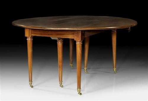 Appraisal: OVAL MAHOGANY EXTENDING TABLE Directoire Paris circa With hinged sides