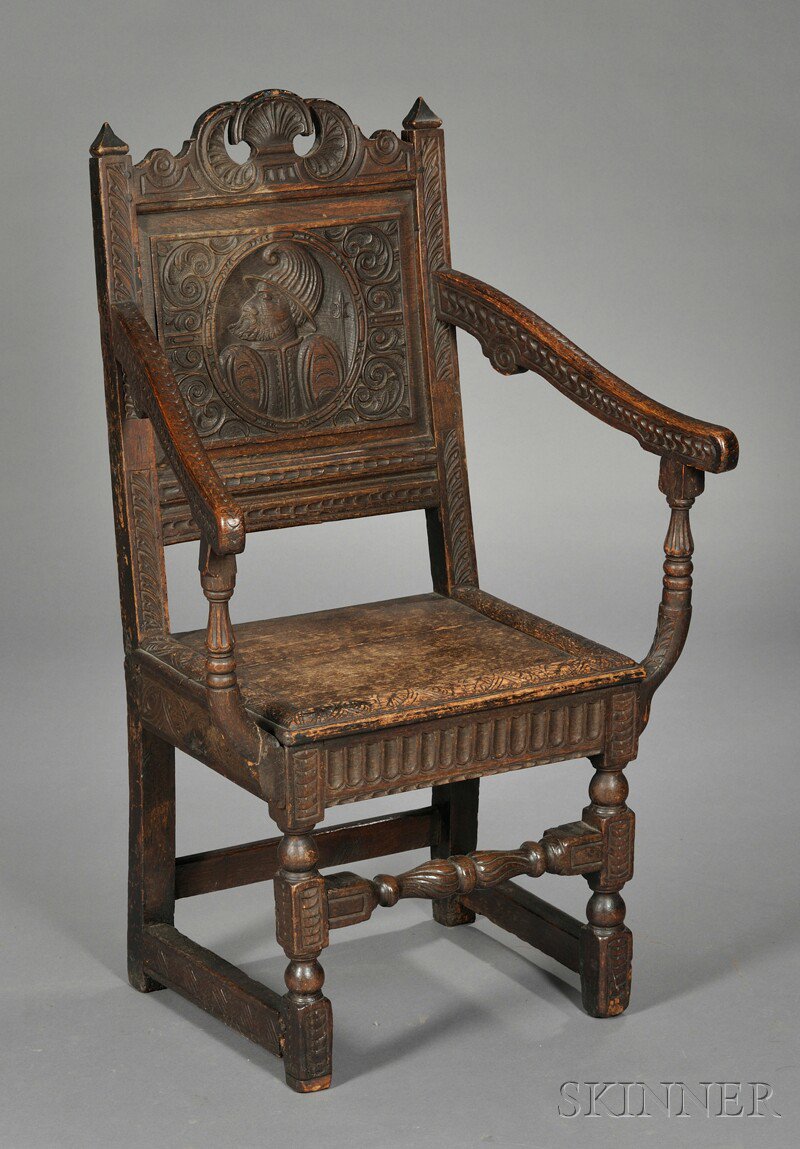 Appraisal: English Carved Oak Armchair allover decoration of various chip-carved motifs