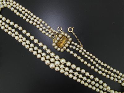 Appraisal: A three row cultured pearl necklace The clasp set with