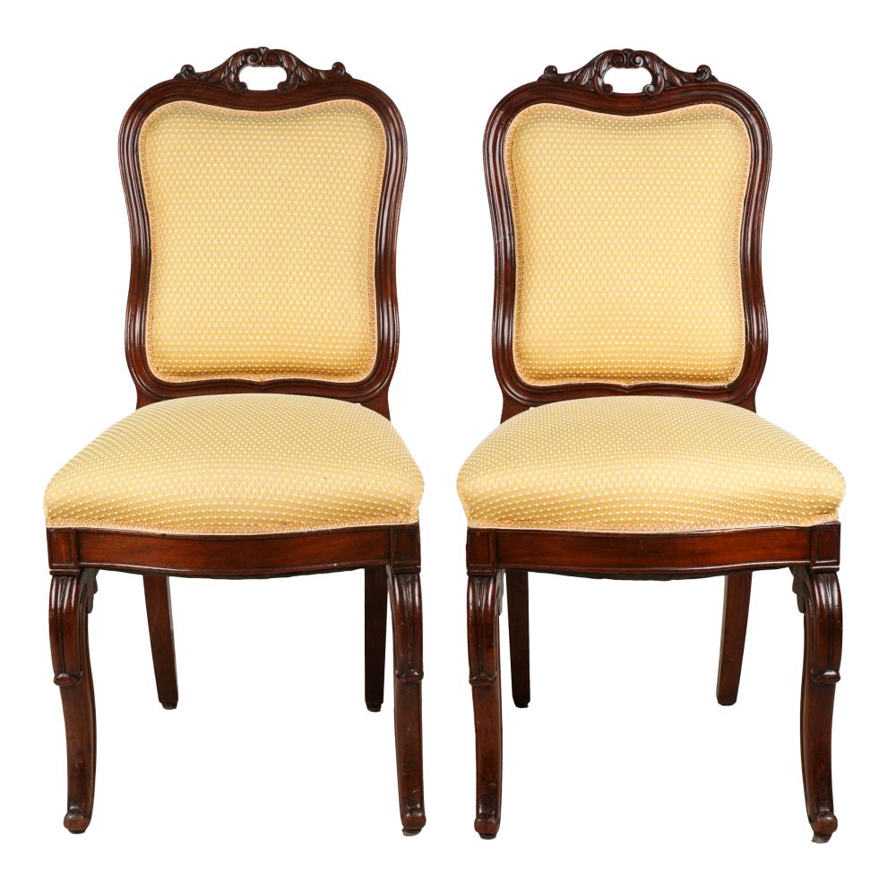 Appraisal: PAIR OF CARVED REGENCE-STYLE SIDE CHAIRScovered with yellow and white