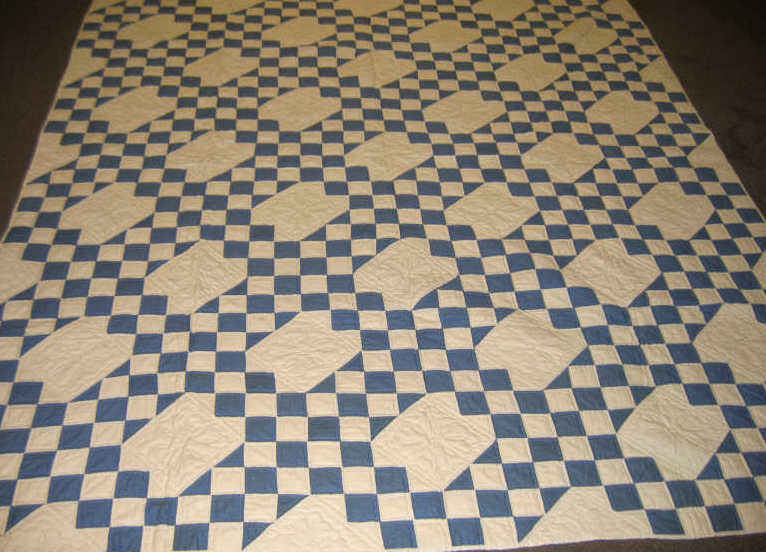 Appraisal: AMERICAN BLUE AND WHITE QUILT Pieced twelve-patch checker-board blocks and