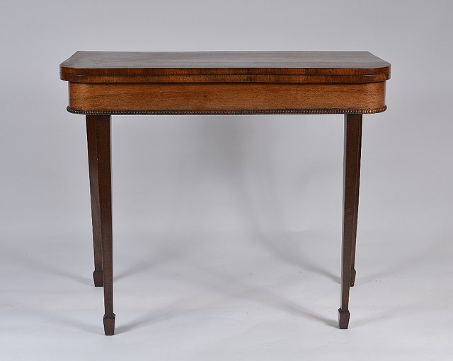 Appraisal: A th Century rosewood fold-over card tablehaving plain 'D' shaped