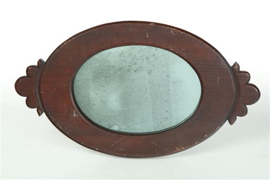 Appraisal: MIRROR American ca walnut Oval with carved decorative ends and