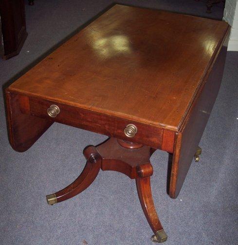 Appraisal: A th Century mahogany Pembroke dining table fitted a single