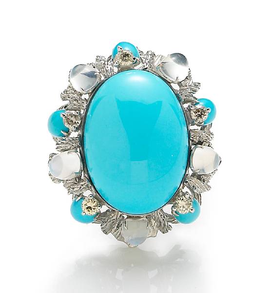 Appraisal: A turquoise moonstone and diamond ring centering a turquoise cabochon