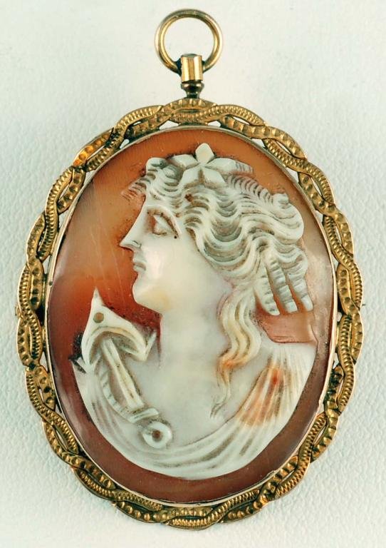 Appraisal: Carved shell cameo in tested K yellow gold filigree frame