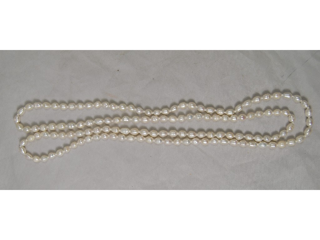 Appraisal: Single row opera length river pearls