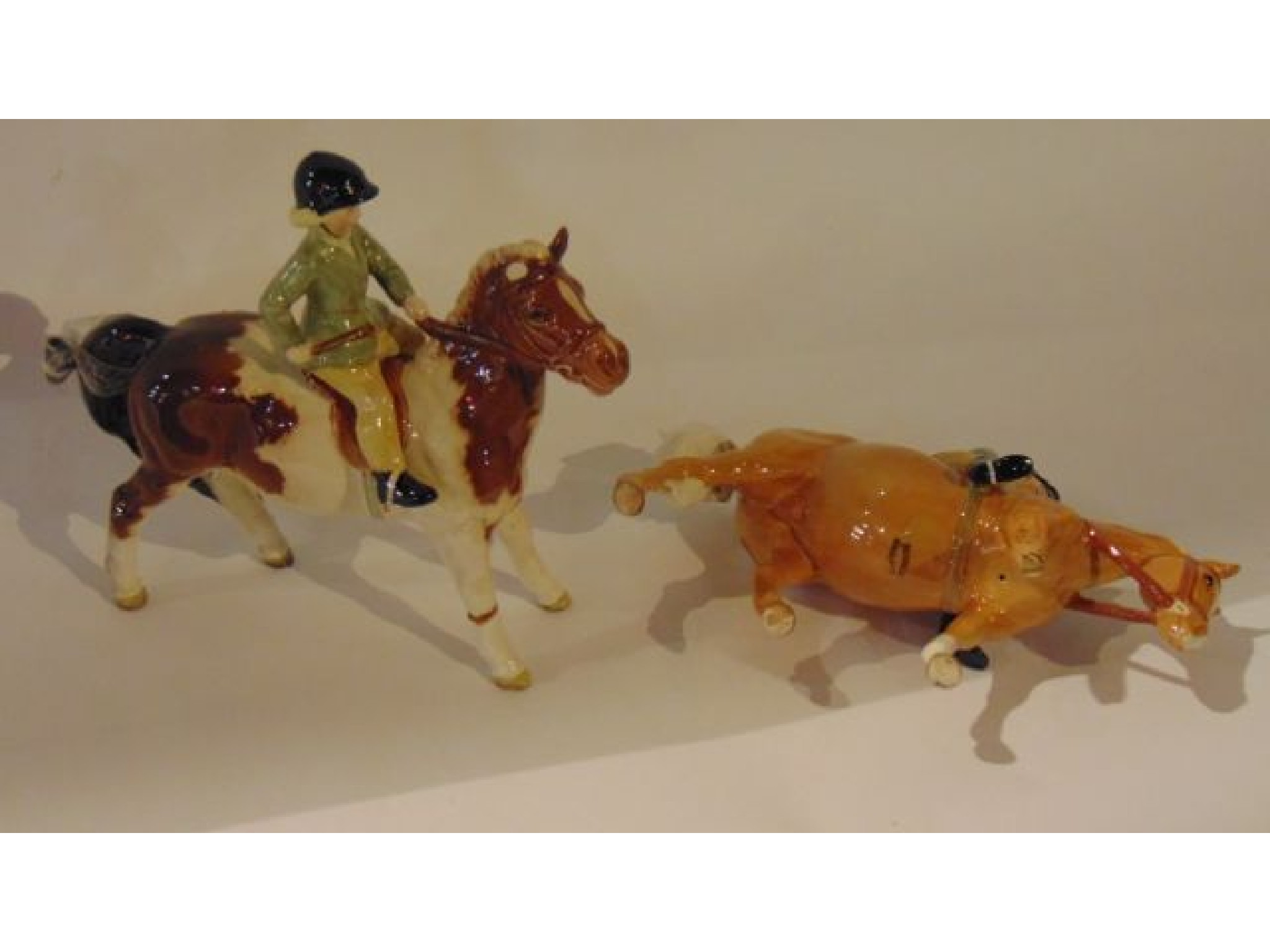 Appraisal: A pair of Beswick figures of a boy and a