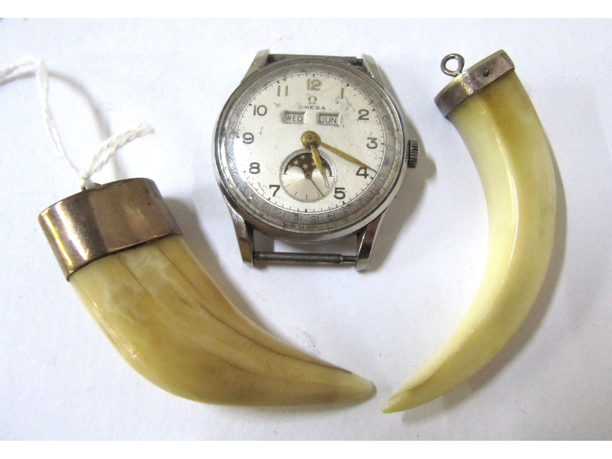 Appraisal: A lot comprising an Omega watch head and two claw