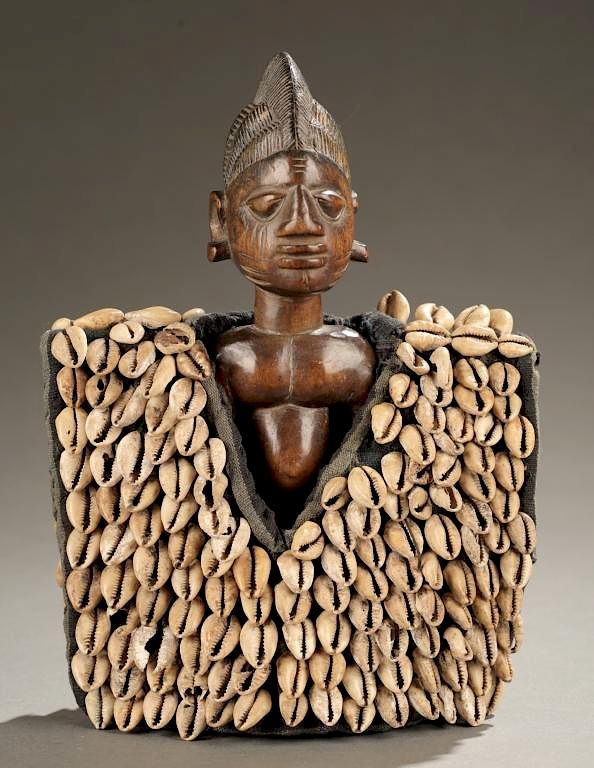 Appraisal: Ibeji figure with cape th c An Ibeji figure with