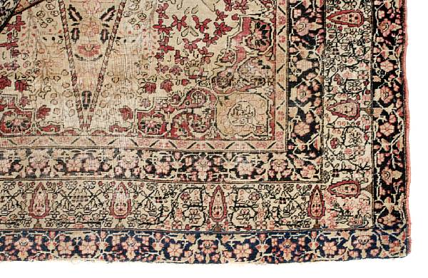 Appraisal: A Lavar Kerman rug worn with losses fading size approximately