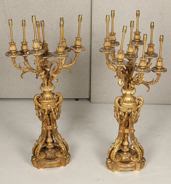 Appraisal: A PAIR OF FRENCH ORMOLU EIGHT BRANCH CANDLE HOLDERS with