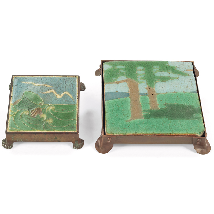 Appraisal: Grueby tile trivets two larger with a scenic pine design