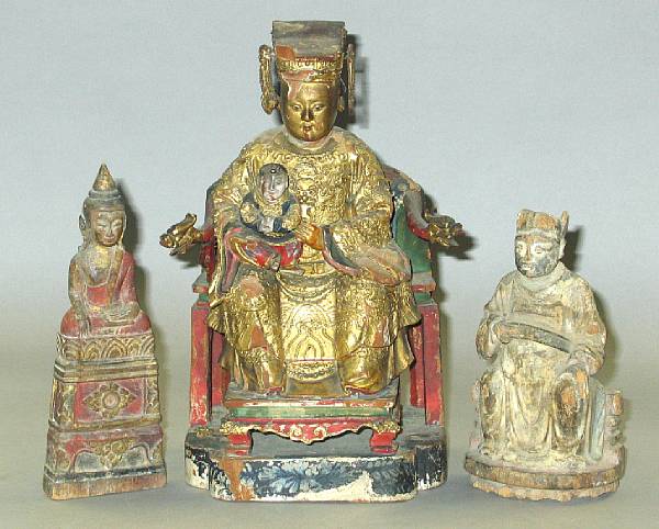 Appraisal: A group of Asian figures The Chinese wood seated male