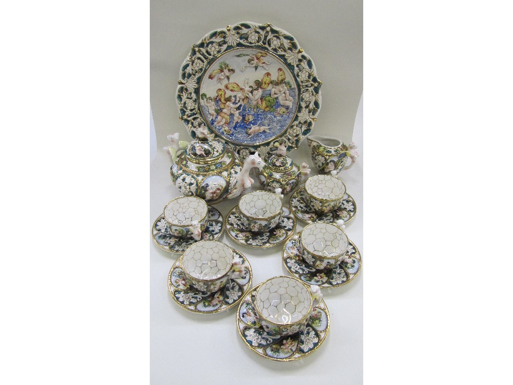 Appraisal: Capodimonte style teaset each piece decorated in relief with cherubs