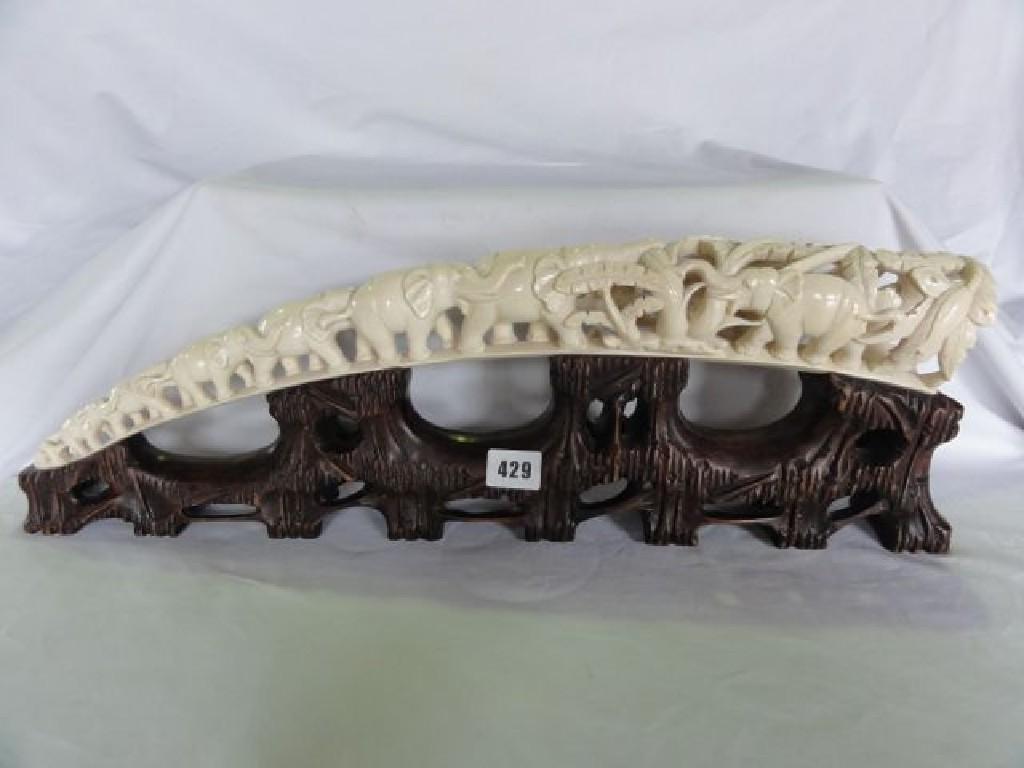 Appraisal: An ivory tusk showing a troop of graduated elephants raised