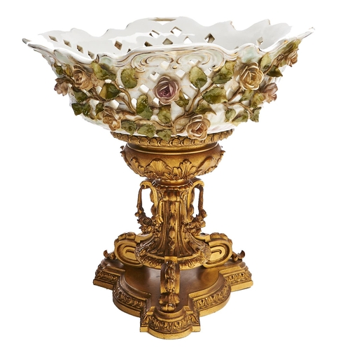 Appraisal: A German floral encrusted and reticulated porcelain fruit stand on