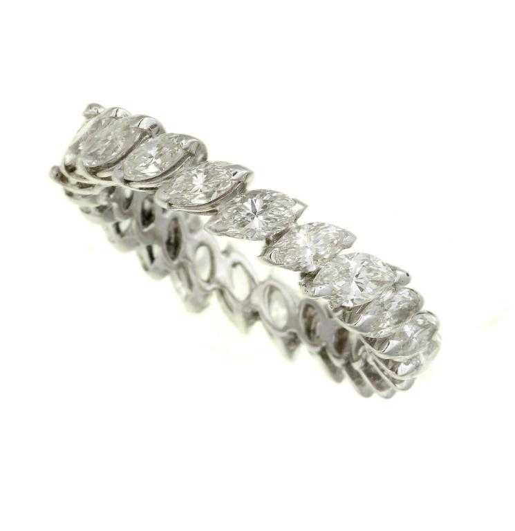 Appraisal: A DIAMOND ETERNITY RING with navette shaped diamonds white gold